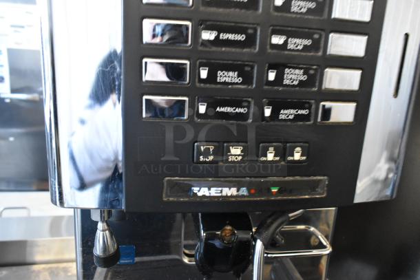 Faema stainless steel commercial espresso machine with steam wand, automatic controls, in used condition.