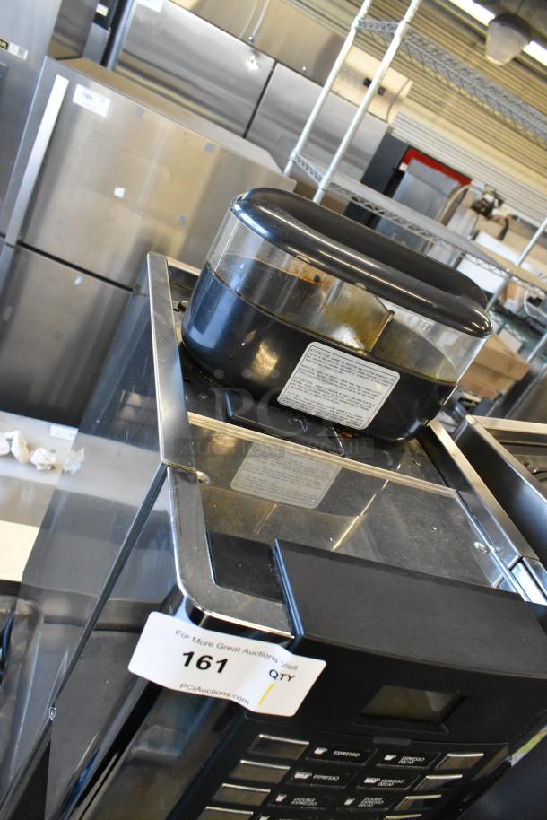 Faema stainless steel commercial espresso machine with steam wand, visible label, and auction tag number 161.