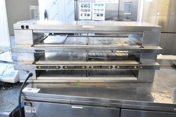 Savory Merco MHCFA34 stainless steel commercial holding bin with two-tier shelves, 208 volts, 1 phase, visible controls.