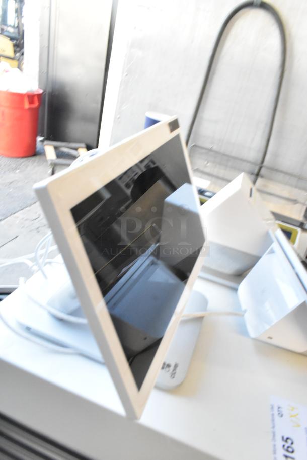 Clover POS System with monitor, receipt printer, and cash drawer. Features white finish, appears lightly used.