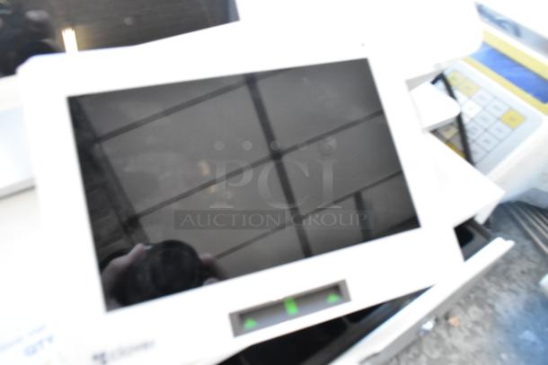 Clover POS System with monitor, receipt printer, and cash drawer; includes visible logo and button interface.