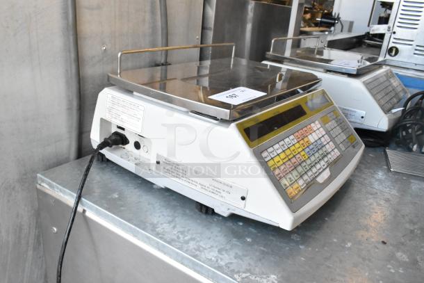Easy Weigh LS-100 metal countertop scale, model LS-100, with keypad, in used condition. 240 Volts, 1 Phase.