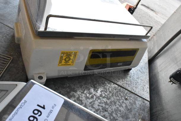 Easy Weigh LS-100 metal countertop scale, 240V, 1 Phase. Features digital display, calibration seal label, good condition.