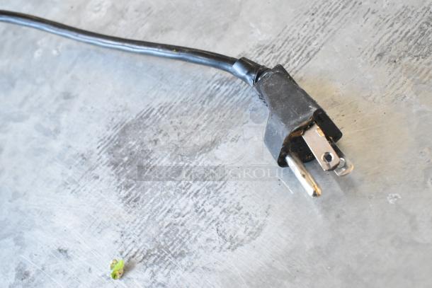 Easy Weigh LS-100 metal countertop scale plug, 240V, 1 phase, with a sturdy black cable on a metallic surface.