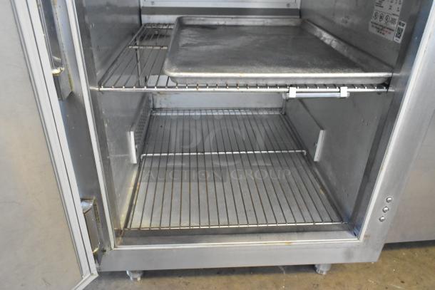 Traulsen stainless steel commercial single door undercounter blast chiller with shelves, showing interior and operating instructions.