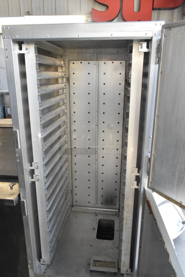 Metro C199 Flavor Hold metal commercial heated holding cabinet on casters; 125 volts, 1 phase; interior shelving visible.