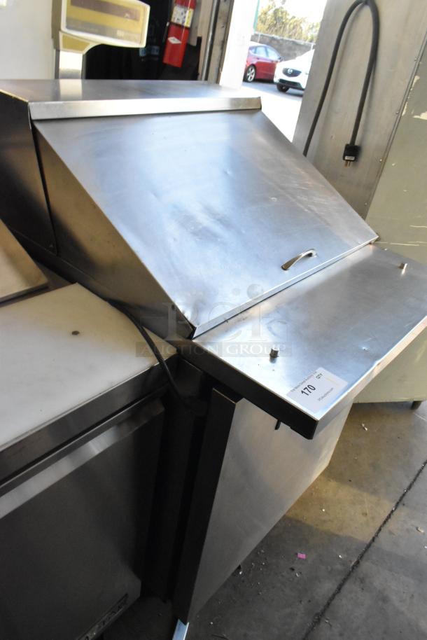 True TSSU-27-12M-B stainless steel prep table with lid, on casters. Good condition. Tag ID visible: 110 GT.