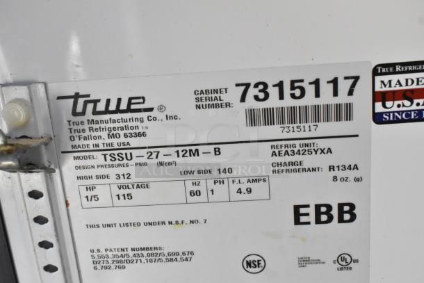 True TSSU-27-12M-B stainless steel commercial sandwich prep table, model label with specifications and serial number 7315117.