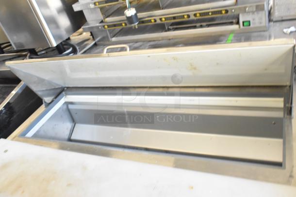 Motak MST-48-X stainless steel prep table, Mega Top, on casters. Features bain marie design, 115V, 1 Phase.