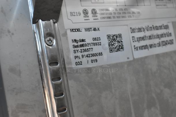 Motak MST-48-X stainless steel prep table label shows model, serial number 692178932, and manufacturing date 0823.