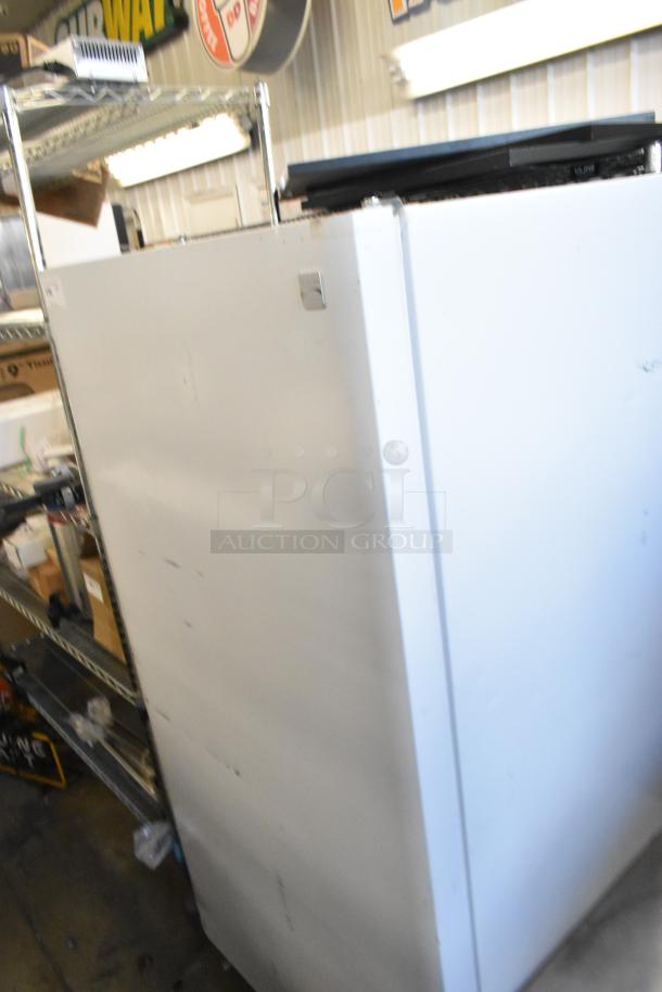 Kenmore Metal Single Door Reach-In Freezer, 115V, 1 Phase, used condition, visible exterior markings, vertical orientation.