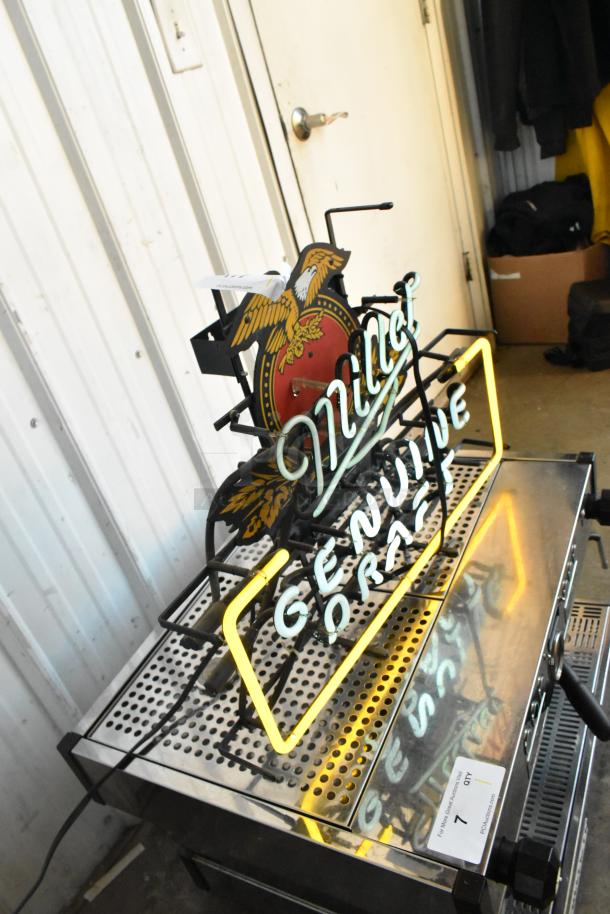 Miller Genuine Draft neon light sign with eagle logo, glowing yellow and white. Good condition, pickup only.