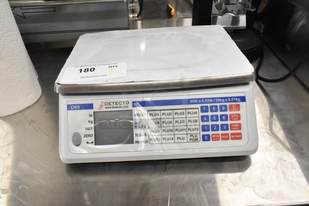 Detecto D60 countertop scale, digital display, 60lb/30kg capacity. Clean condition, visible branding and model label.