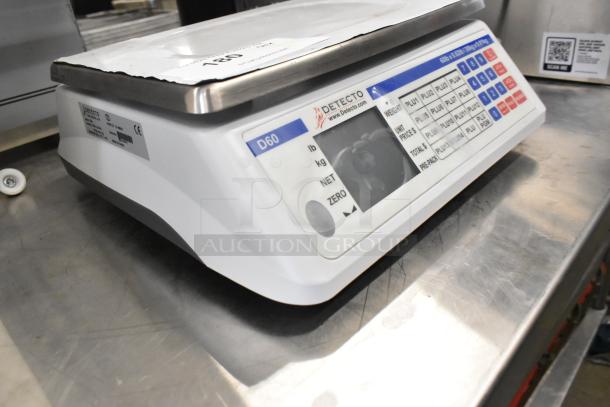 Detecto D60 countertop scale with digital display and function buttons. Clean, used condition with visible model markings.