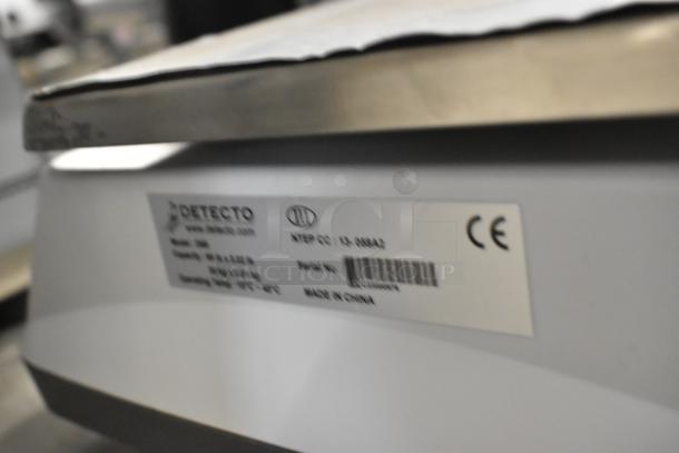 Detecto D60 countertop scale, model D60, with serial tag showing capacity and origin, in good condition. Made in China.