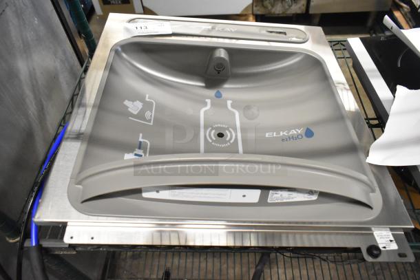 Brand new Elkay ezH2O water fountain bottle filler. Features sensor activation and stainless steel finish. Scratch and dent condition. 