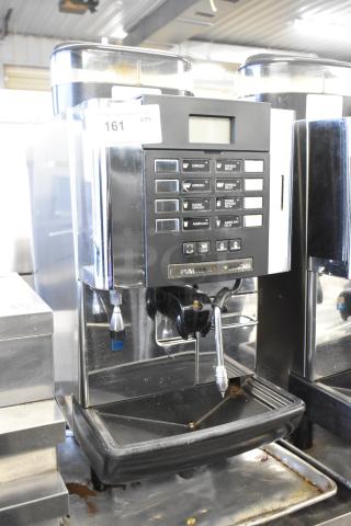 Faema X1 Grand Italia automatic espresso machine, stainless steel, with steam wand, control panel, and visible wear.