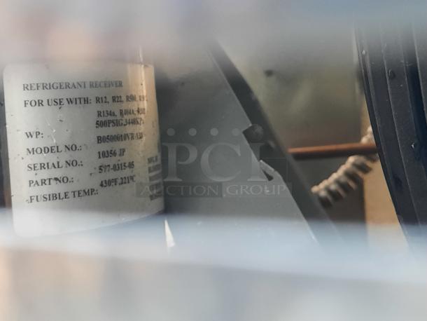 Norlake Self Contained Walk-In Box with condenser, 208-230V, 1 phase. Visible label details model 1036 JP, compatible refrigerants.