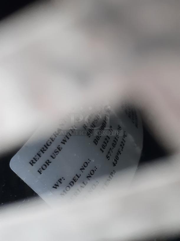 Blurred label for Norlake walk-in cooler, showing model and serial numbers, suitable for 208-230V, 1 phase.