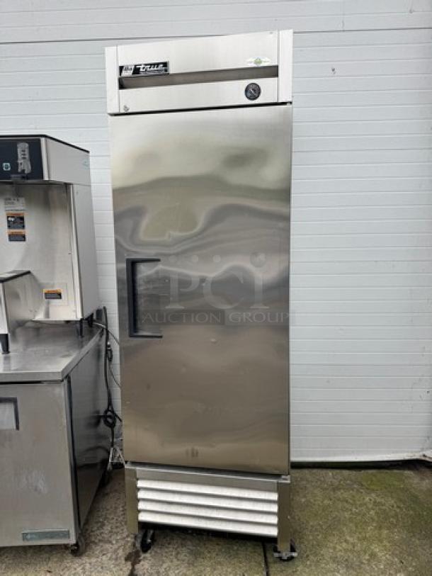 TRUE T-23 Single Door Refrigerator on casters, stainless steel, 115V, tested, working condition, exterior in good shape.