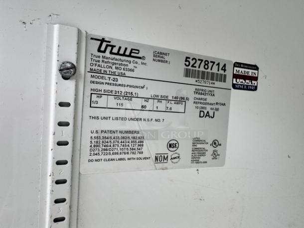 TRUE T-23 Refrigerator label showing model details, 115V, R134A refrigerant, made in USA, serial number 5278714.