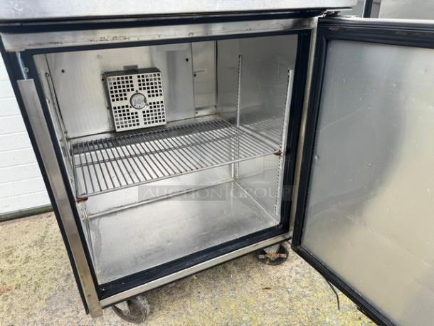 TRUE TWT-27-HC undercounter refrigerator, single door, on casters, stainless steel, 115V, tested and working, clean interior.