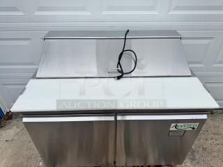 AVANTCO 2 Door Sandwich Table, model 178SCL2, on casters, stainless steel, 115V, tested and working, with brand label.