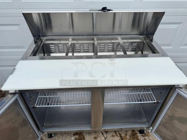AVANTCO 2 Door Sandwich Table, Model 178SCL2, on casters, 115V, stainless steel, tested and working, features open top and shelving.