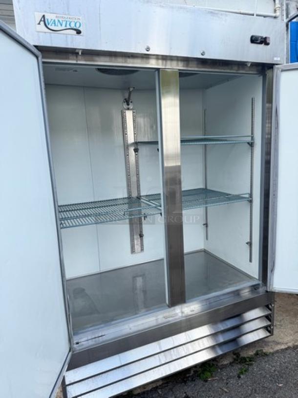 AVANTCO 178A49RHC 2 Solid Door Refrigerator, on casters, stainless steel, 115V, open doors, shelving inside, clean condition.