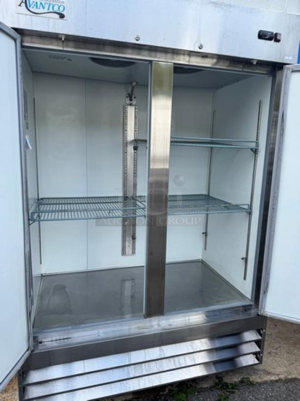 AVANTCO 178A49RHC 2 Solid Door Refrigerator on casters, stainless steel, tested and working, 115V, interior racks visible.