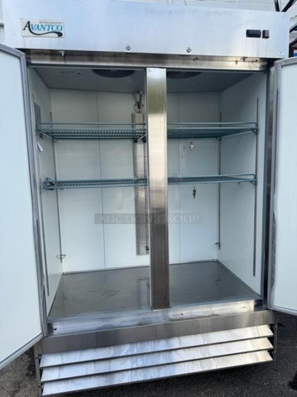 AVANTCO 178A49RHC 2 Solid Door Refrigerator, stainless steel, on casters, 115V, tested and working, dual shelves inside.