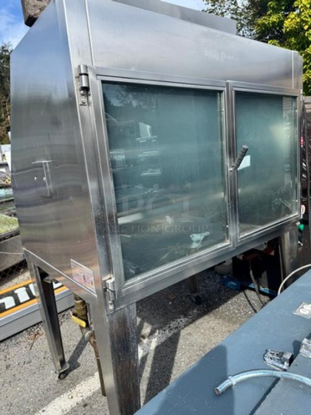 HARDT Inferno rotisserie oven, natural gas, 40 chicken capacity, model INFERNO, one broken handle, used condition.