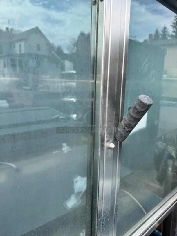 HARDT Inferno natural gas rotisserie oven, 120V, capacity 40 chickens, one broken handle visible.