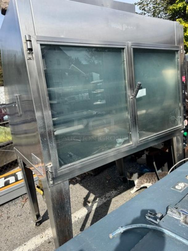 HARDT Inferno natural gas commercial rotisserie oven, capacity 40 chickens, 120V, one broken handle, stainless steel.