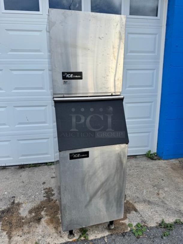 Ice o-Matic Ice Maker with Bin, Model ICEO320HA2, tested and working, 115V, stainless steel, logo visible, outdoor setting.