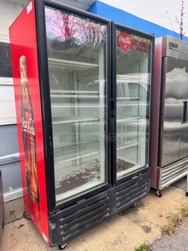 Imbera VRD43 glass door refrigerator, tested and working, 115V, Coca-Cola branding, visible shelving, good condition.
