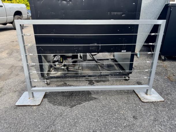 Portable Fence BIDX2, metal frame, wire strands, sturdy base plates, outdoor use, good condition.