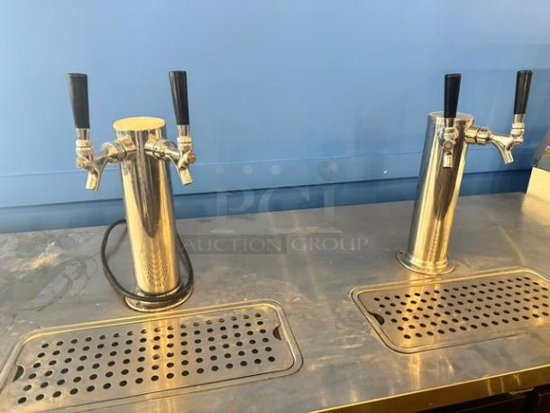 AVANTCO 3-door, double tap kegerator beer dispenser model 178UDO72HC, black, 115V, tested and working, on stainless steel surface.