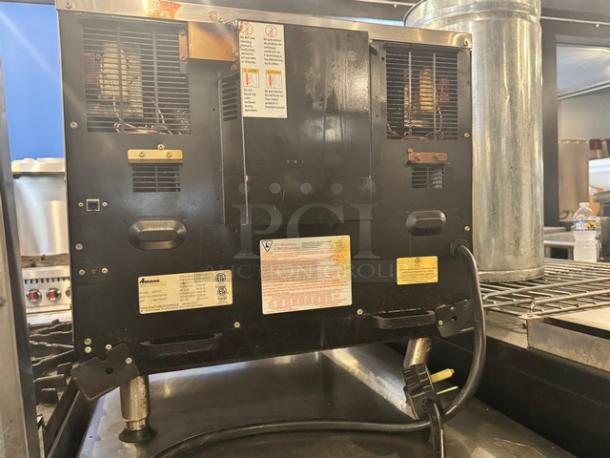 Amana Xpress AXP22T countertop convection oven, 208/240V, visible labels detailing specs, black finish, used condition.
