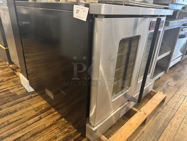 Garland Master 300 natural gas single deck convection oven, stainless steel, full size, pristine condition, auction tag visible.