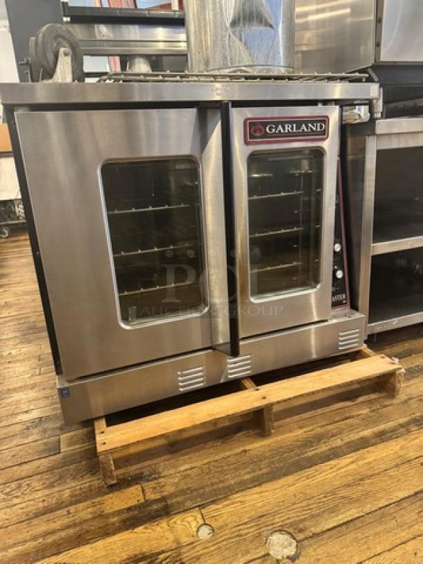 Garland Master 300 natural gas full-size single deck convection oven, stainless steel, dual glass doors, visible controls, excellent condition.