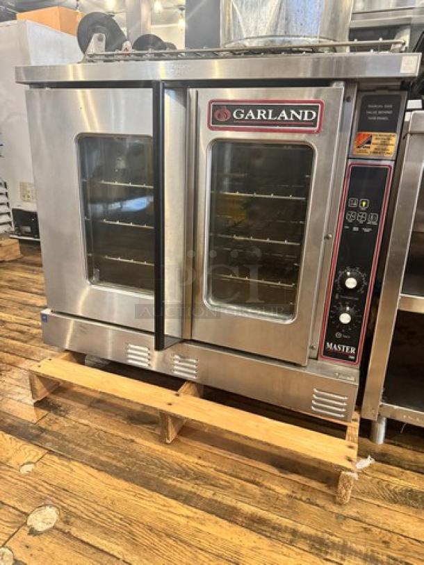 Garland Master 300 natural gas single deck convection oven, stainless steel, multiple racks, front control panel, used condition.