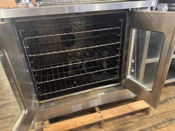 Garland Master 300 natural gas single deck convection oven, stainless steel, open door view, multiple racks, good condition.