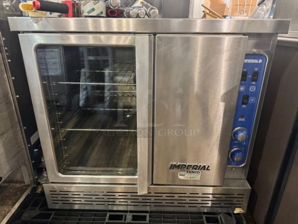Imperial Natural Gas Full Size Single Deck Convection Oven with Legs, stainless steel, control knobs and clear viewing window, excellent condition.