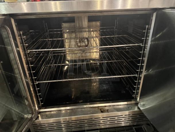 Imperial Natural Gas full-size single deck convection oven with legs, features interior racks; visible wear.