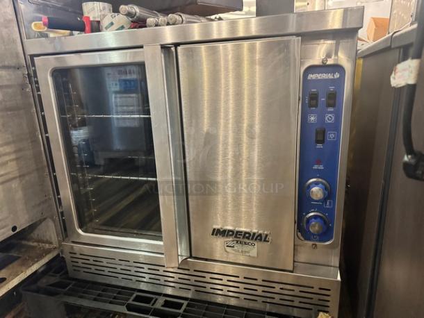 Imperial natural gas full-size single deck convection oven with legs, brushed stainless steel, control panel, and visible racks.