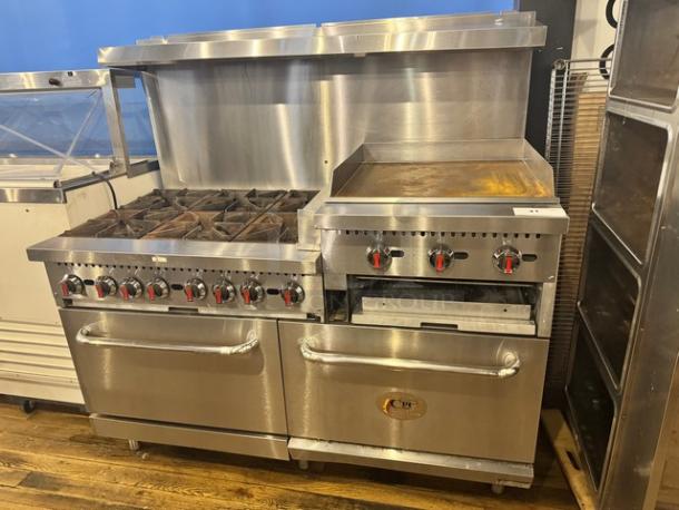 CPG Natural Gas Stove with 6 Burners and 24" Griddle, stainless steel, used, on legs, red knobs, dual ovens.