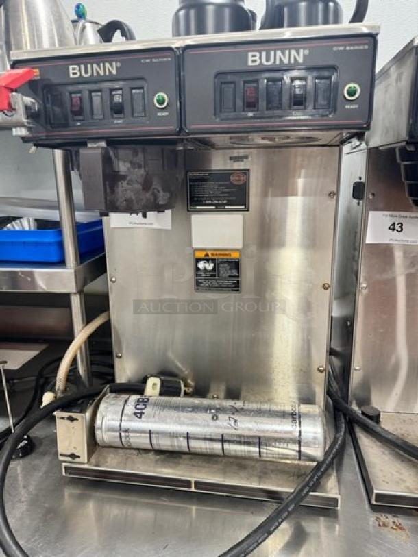 BUNN CW Series Dual Coffee Brewer, 120V, stainless steel, dual spouts, visible controls, industrial setting, used condition.