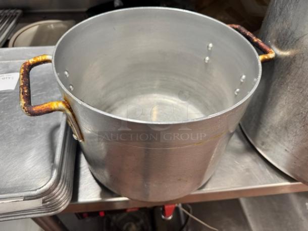 10x8" aluminum stock pot with rusted handles. Visible wear, suitable for cooking or restaurant use.