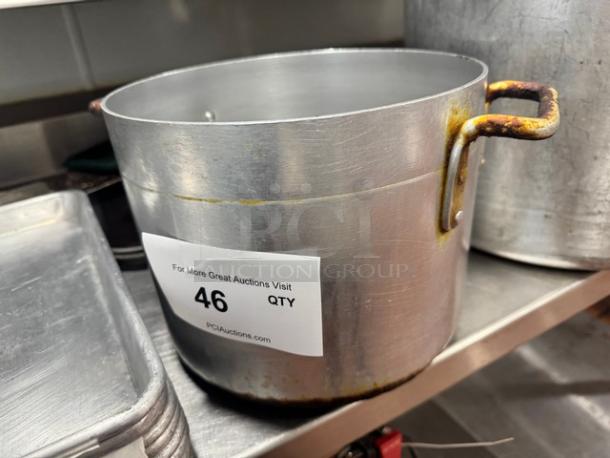 10x8" aluminum stock pot with slight rust on handles, label marked "46" for auction reference.